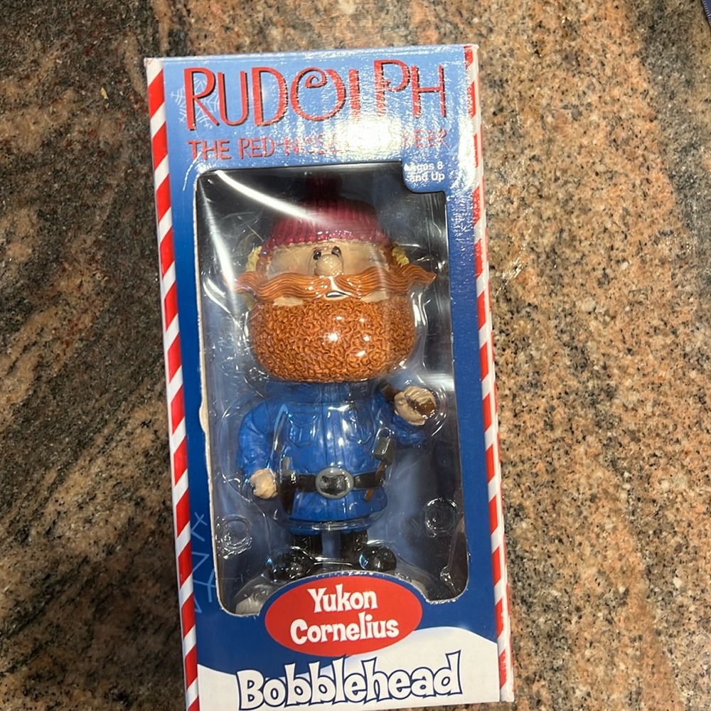 Yukon Cornelius bobblehead stands approx 6 1/2 inches tall.